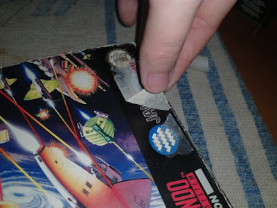 retirar pegatina caja snes
